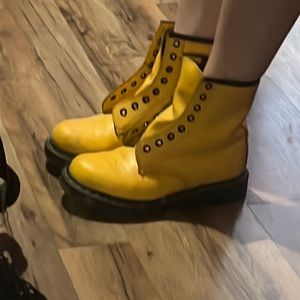 1460 Yellow Doc Martens, no laces, speckled in black paint.